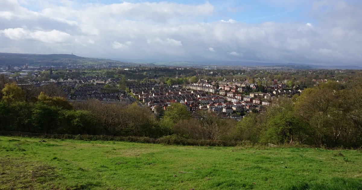 A view across Huddersfield, West Yorkshire, showing the town's mixed industrial and residential rooftops.