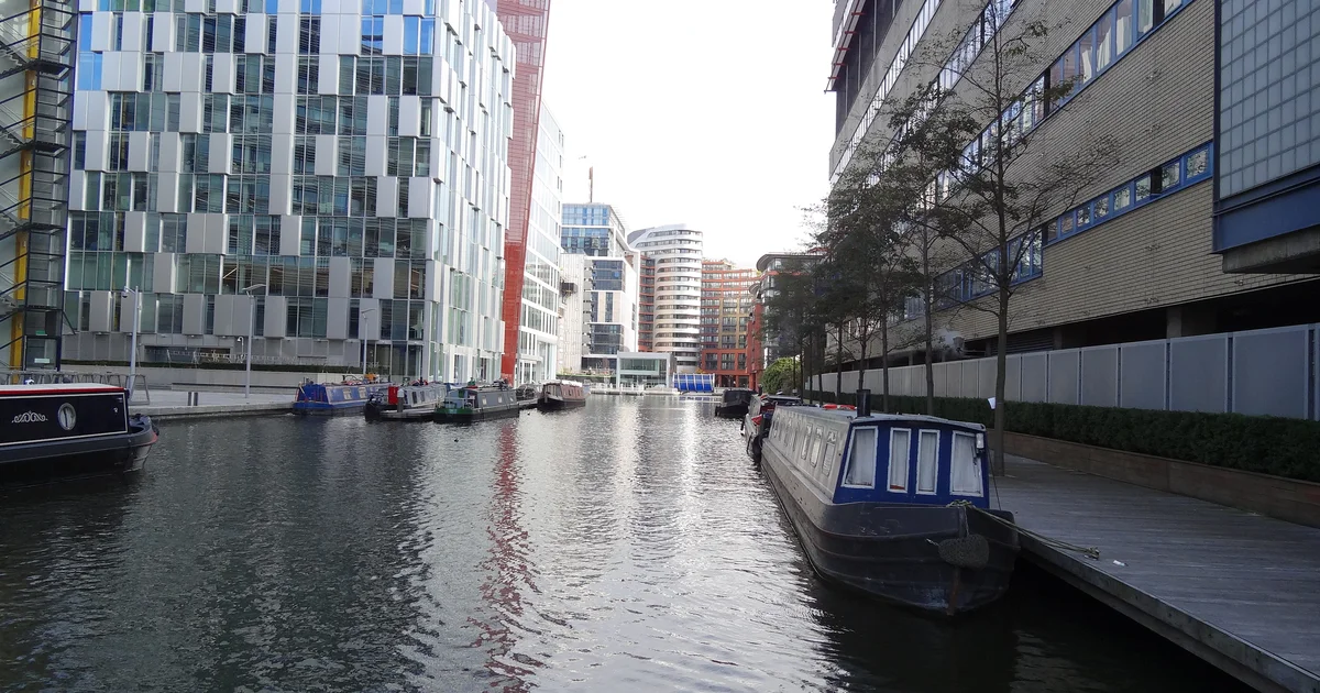 Paddington Basin, London, lined with modern office buildings.