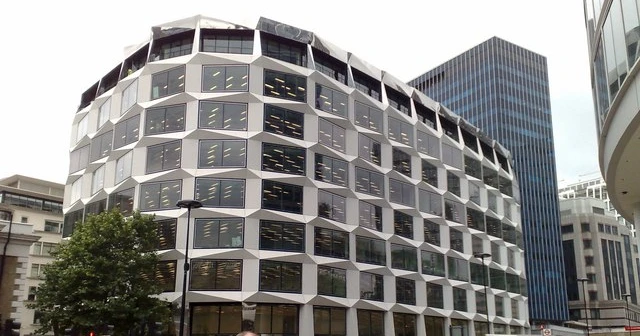One Coleman Street, Legal & General's City of London headquarters, its distinctive honeycomb glass facade seen from street level.
