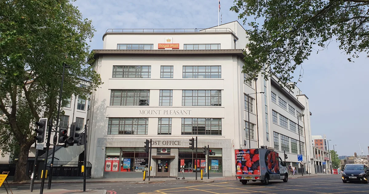 Mount Pleasant sorting office on Farringdon Road, London, with the Royal Mail sign on the roof.